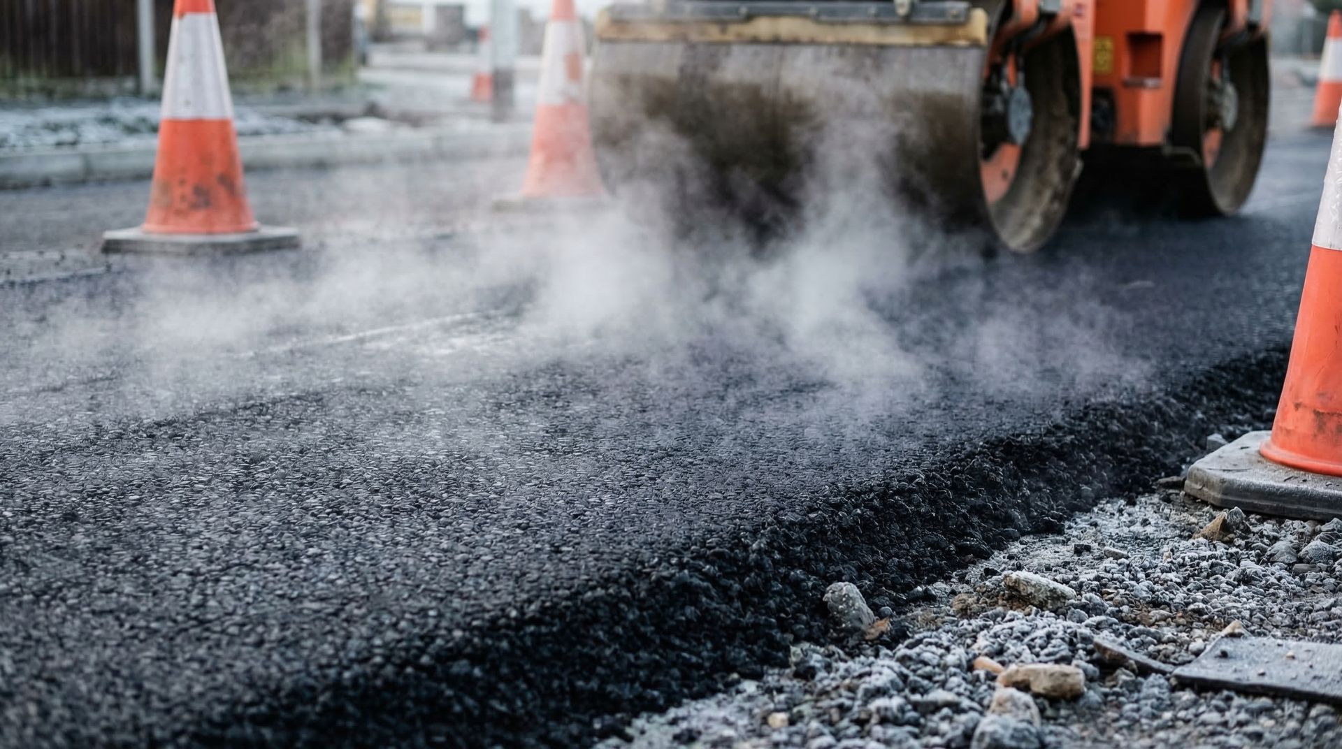Professional commercial paving crew rolling out durable new asphalt.